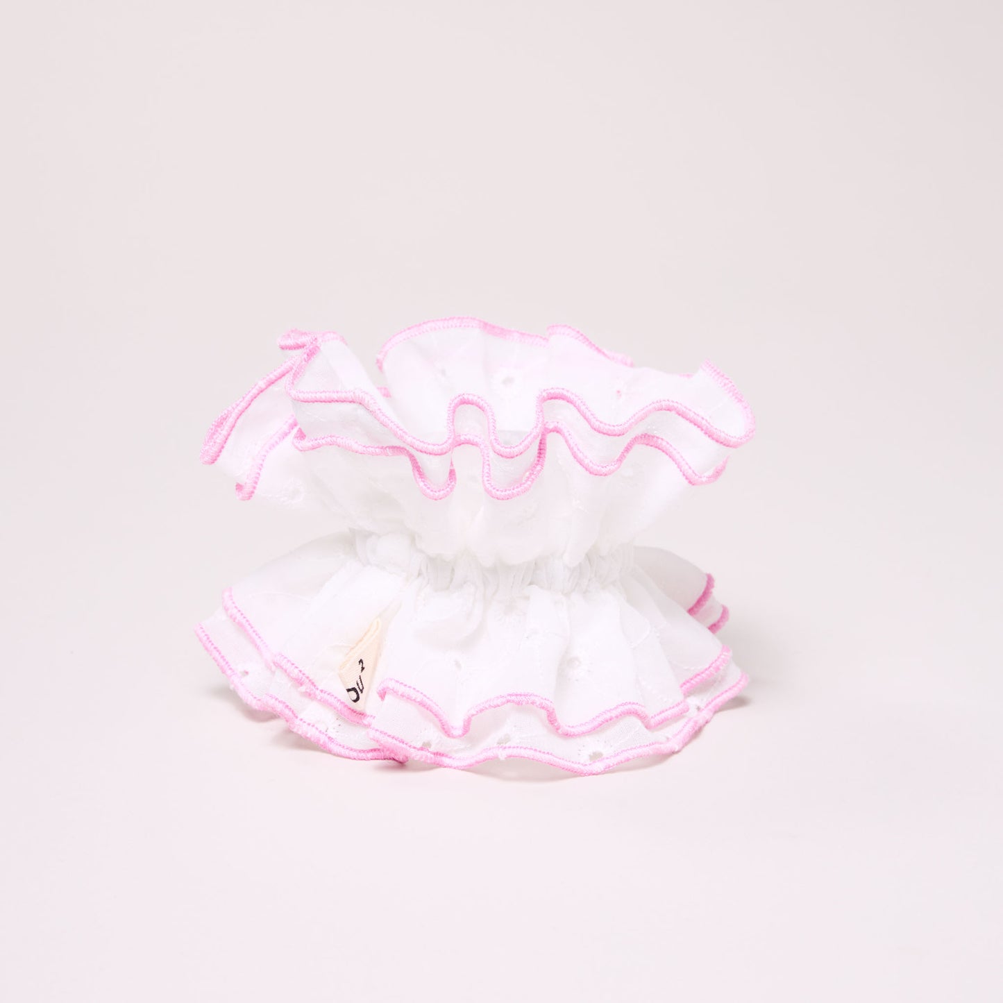 Maxi chouchou en broderie anglaise - bord rose